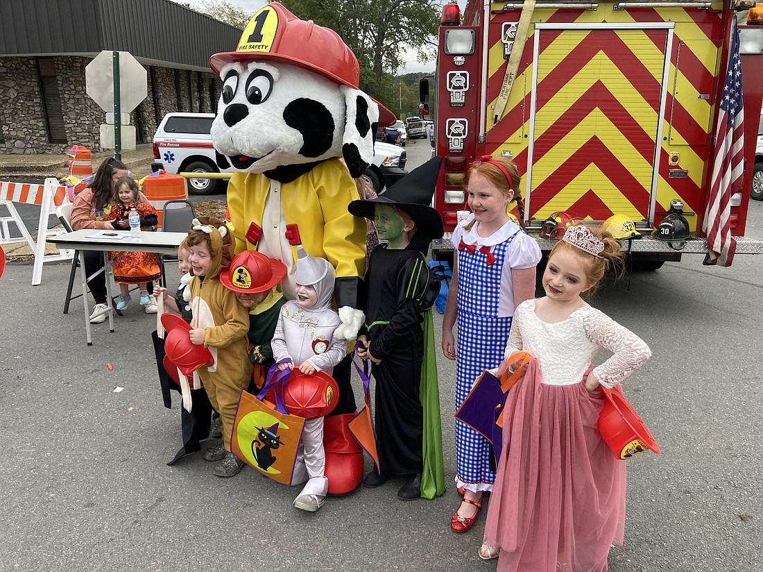 CHILDREN OF ALL AGES enjoyed visiting dozens of booths set up around the Grant County Courthouse to play games and receive candy and other goodies Sunday. The carnival included booths set up by local businesses, churches and community organizations; costume and pet costume contests; a pumpkin decorating contest and much more. Photo by Byron Tate