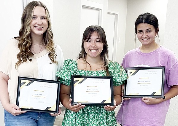 Sheridan High School students Kyliee Witty, Marissa Nevens and Kennadie Hobson were honored with Certificates of Achievement for having the top art in the City of Sheridan Seal art contest at the Sheridan City Council meeting on June 6.