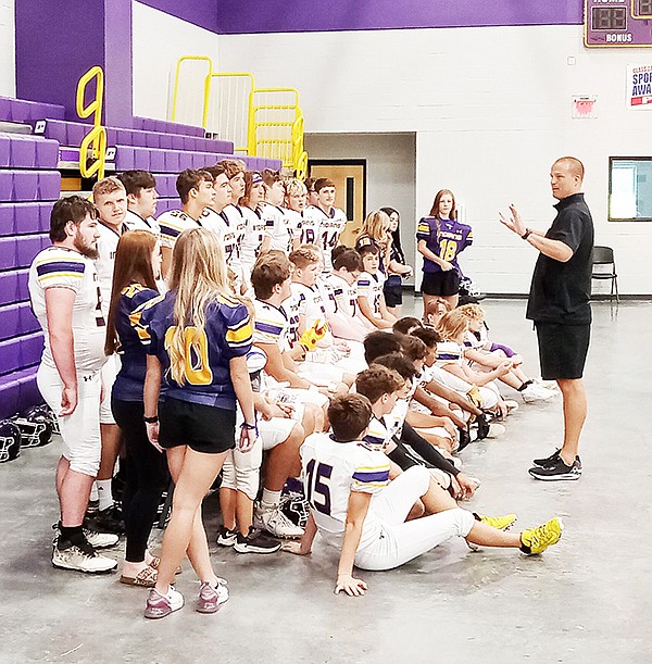 Poyen Head Football Coach Vick Barrett gathers his team for a quick pow-wow during the Indians’ Media Day event on Friday, Aug. 11.  Photo by Eric Moore