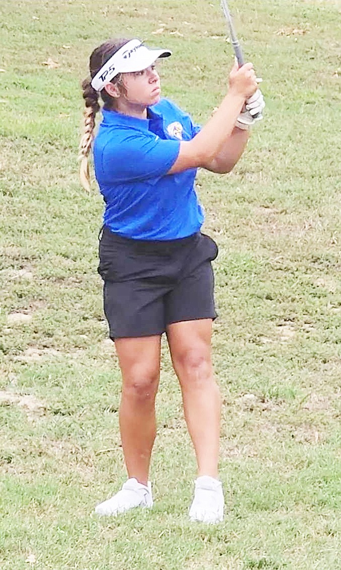 Sheridan's Marissa Nevens watches her shot head toward the hole during the Longhills Invitational last week. The Lady Yellowjackets got season-best performances from all involved to finish second at the event.