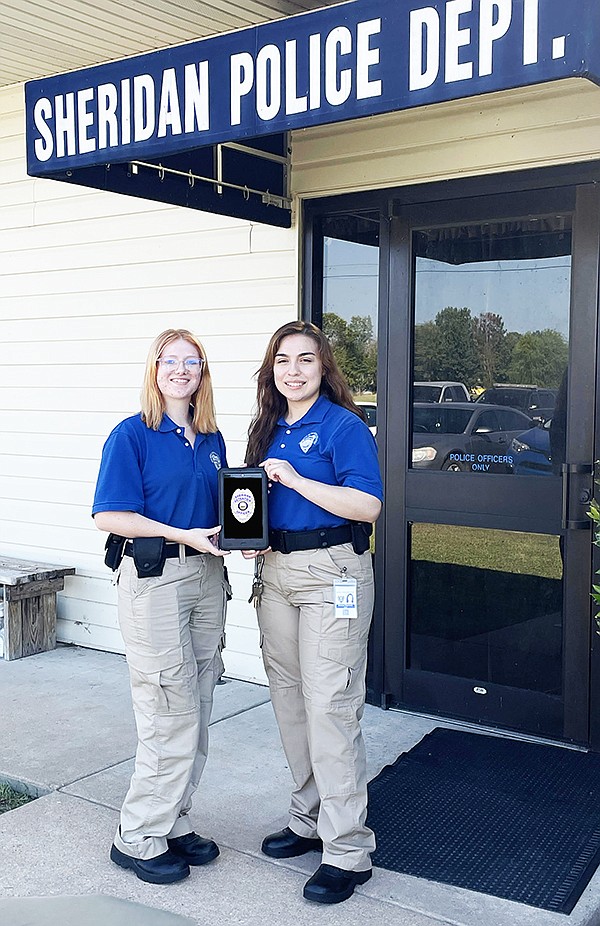 Sheridan Detention Center Jailers Bridget Sullivan (left) and Melanie Espinosa (right) show off new tablets SDC received for inmates that will be used for educational purposes as well as telecommunications. Photo by Gretchen Ritchey