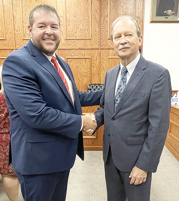 ARKANSAS SUPREME COURT JUSTICE DAN KEMP (right) was greeted by Circuit Judge Stephen Shirron last week during a visit at the Grant County Courthouse. Photo by Gretchen Ritchey