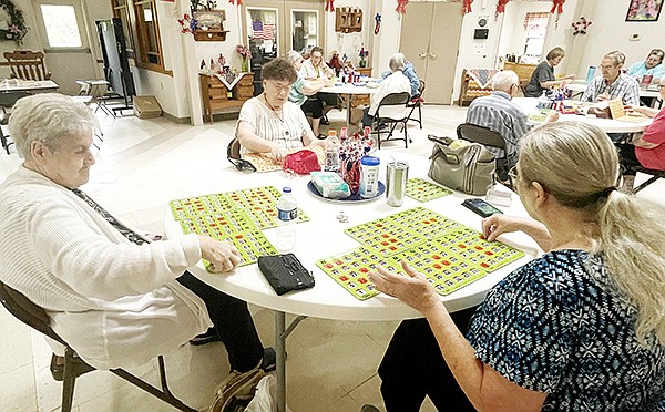 Ida Lantz, Debbie Gauth and Louise Baker play Nickel Bingo, one of many activities enjoyed by area senior centers at the Grant County Senior Center on Sept. 5. Photo by Gretchen Ritchey