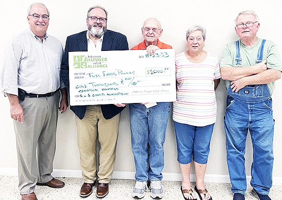 The Arkansas Hunger Relief Alliance recently donated $1,000 to the Tull Food Pantry. Pictured left to right are Sen. Kim Hammer, Lance Whitney, Arkansas Hunger Relief Alliance Advocacy director, Wilson DuValll, Dot Bowers, and Ed Bowers.
