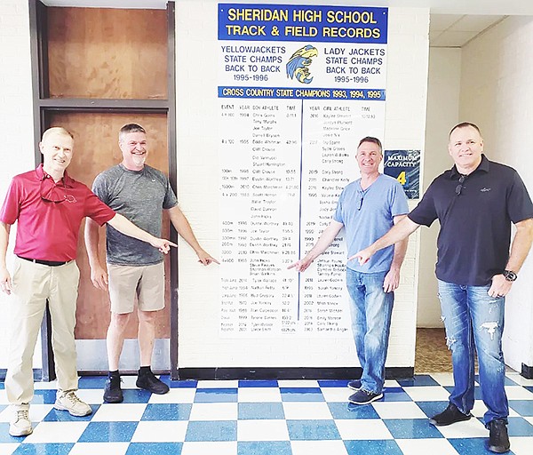 On May 4, 2023, the Sheridan High School senior boys 4X400 meter track and field team competed at the state meet, breaking a 35-year-old Sheridan High School record in the event.  Ethan Anderton, Nathan Uptagrafft, Iziah Owens and Aaron Webb ran the event in a time of 3:25.82, a new school record. During the Yellowjacket Homecoming festivities on Sept. 29, the previous record holders visited the school record board to congratulate the new record holders, and to commemorate their 35-year-long school record in the event. Shannon Winston, Steve Reaves, John Hicks and Brian Watkins (pictured) previously set the record in the event with a time of 3:27.90 in 1989. “While we are proud of our accomplishments as competitors in high school, Yellowjacket pride transcends generations. Accordingly, we are proud to recognize these great competitors who now hold the new school record,” said John Hicks.