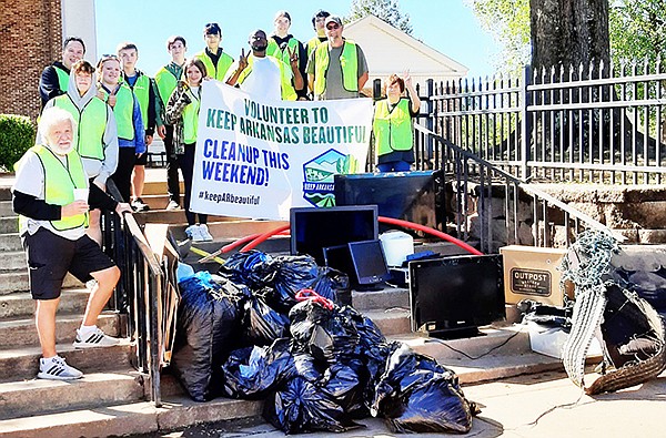 OVER TWO DOZEN VOLUNTEERS joined together Saturday morning to help clean up Sheridan as part of the Keep Sheridan Beautiful event.