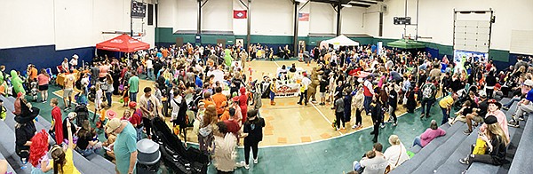 NEARLY 6,000 FAMILIES enjoyed the festivities of the Grant County Fall Carnival Saturday despite the rainy weather and thanks to the quick thinking and hard work of the carnival coordinators and volunteers who made the fast switch to the Sheridan Recreation Center. Photo by Byron Tate