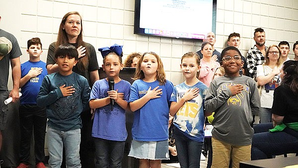 Sheridan Elementary School students helped lead the Pledge of Allegiance prior to the start of the school board meeting on Nov. 6. Pictured (left to right) are Ian Axel Gerardo Gonzalex, Aurora Cox, Ava Carter and Ellie Kate Higgins, along with SES Principal Dr. Lindsey Bohler.