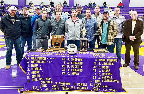 Members of the 2002 Poyen Indians state championship basketball team were honored on Friday, Jan. 12. Those in attendance were (front row from left) James Russell, Anthony Edwards, Dustin Green, Matt Williamson, Jason Otwell, Jake Sharp, Gary Shoptaw, (back row from left) Cory Hurst, Colby Rushing, Jake Byrd, Heath Batchelor, Robby Daniel, Jared Shoptaw.