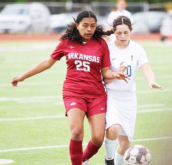 Sheridan's Rebecca Solano (right) moves the ball up the field against pressure from a player from Texarkana during the Lady Jackets' 5-1 conference win against the Lady Razorbacks. (Photo by courtesy of Stan Hancock)