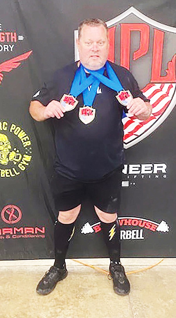 SHERIDAN POWERLIFTER JODIE MCCLURE has set national records and now has his sights set on the world championship this fall.