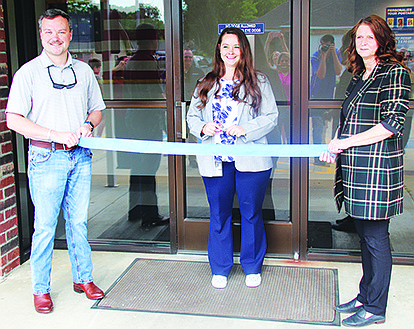 THE SHERIDAN POST OFFICE celebrated its grand reopening July 27 with a ribbon cutting ceremony and Sheridan Commemorative Postcards and stamp. Pictured are Sheridan Mayor Cain Nattin, Sheridan Postmaster Lauren Caputo and Manager of Post Office Operations Barbara Pacheco. Photo by Eric Moore