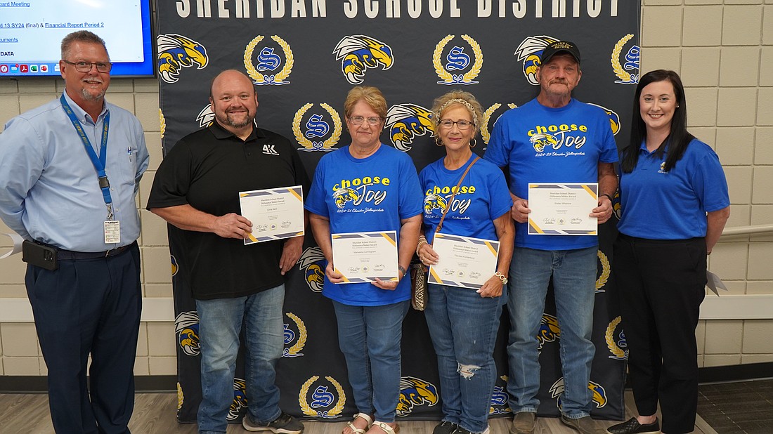 Sheridan School District bus drivers Chris Neel, Markeeta Cunningham, Theresa Funderburg and Walter Whitmire were presented with “Difference Maker” awards at the district’s monthly school board meeting Sept. 9. These drivers volunteered to attend the East End Elementary and East End Intermediate open house events in August. While at the open houses, the drivers talked to parents, explained the new bus rules and assisted with questions about routes. Also pictured with the drivers are Dennis Emerson, Director of Administrative Services, and Dr. Binz, EEI principal.