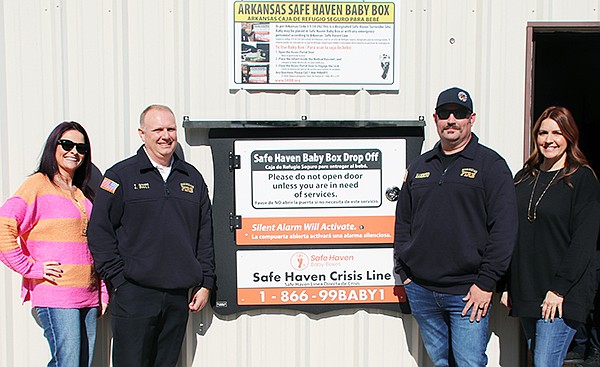 The Safe Haven Baby Box located at the Sheridan Fire Department was officially dedicated and opened to the public on Thursday, January 23. Pictured left to right is Assistant Project Coordinator Mariah Betz with Safe Haven Baby Box, Sheridan Fire Department Assistant Chief Jo Scott, Sheridan Fire Department Chief Ben Hammond and Jessi Getrost with Safe Have Baby Box. Photo by Gretchen Ritchey