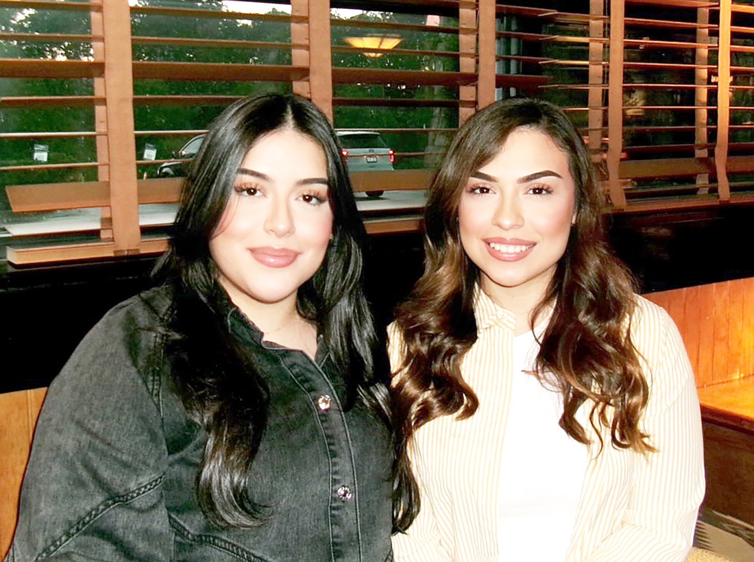 Sheridan Police Officer Melanie Espinsoa (right) and sister, Ashlee. (Photo: Special to The Headlight)