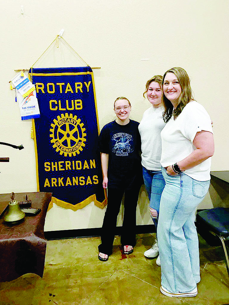 Lauren Fleming (left) and Klaesy Knoefler, pictured with adviser Lindsay Rich, spoke to Rotarians about the FCCLA (Family, Career and Community Leaders of America ) program and their upcoming national competition in Orlando, Fla. The two recent Sheridan High School graduates will compete in culinary events later this week. (Photo by Gretchen Ritchey)