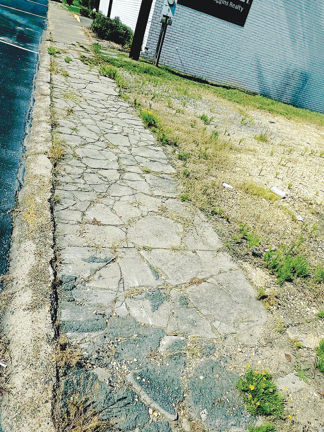 The city is looking to take ownership of sidewalks so it can make repairs to them. (Photo: Gretchen Ritchey)