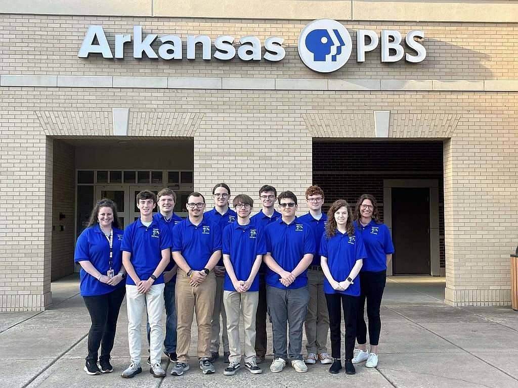 The Sheridan Quiz Bowl team poses in front of the PBS building on the University of Central Arkansas campus where they played in the championship match. From left, front row: Olivia Lewis, Mitchell Ray, Preston Benning, Brent Martin, Gavin Goldman and Sydney Bergeron;

Back row, from left: Michael Poulsen, Cade Lazenby, Avery Williams, Noah Long and Gifted and Talented Coordinator Summer Williams  (Photo: Sheridan School District)