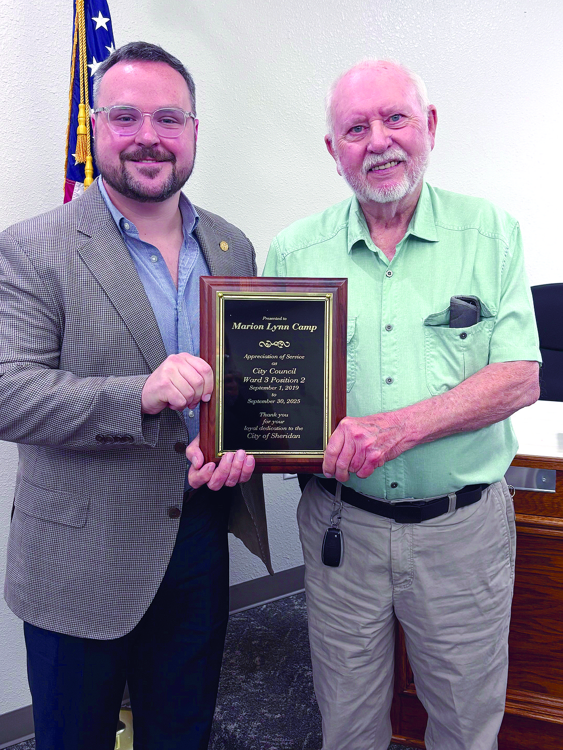 Sheridan City Council Member Lynn Camp (right) was presented an appreciation plaque, for his years of service to the city during the September Sheridan City council meeting, from Mayor Cain Nattin. Camp was attending his last meeting as a council member. (Photo: Gretchen Ritchey)