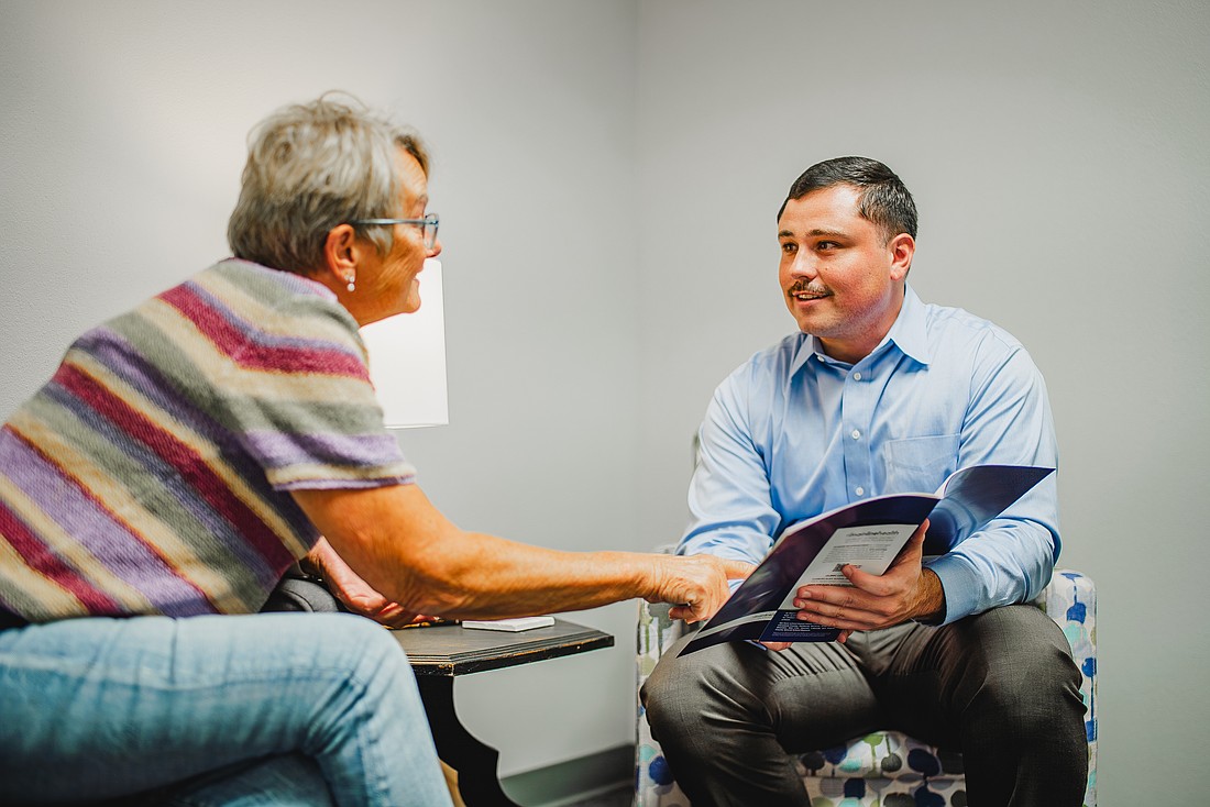 Dr. John Mitchell talks with a patient at Mainline Health Systems’ clinic in Sheridan. (Photo: Mainline Health Systems)