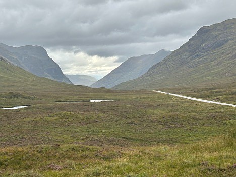 THE VIEW FROM HERE — On the ground, the Scottish Highlands are a ruggedly beautiful but barren place. Glaciation in the last 15,000 years stripped off the soil, so knee-high heather and clumps of grass, ferns and mosses make up most of the vegetation. (Photo: Courtesy of Gerald Klingaman.)