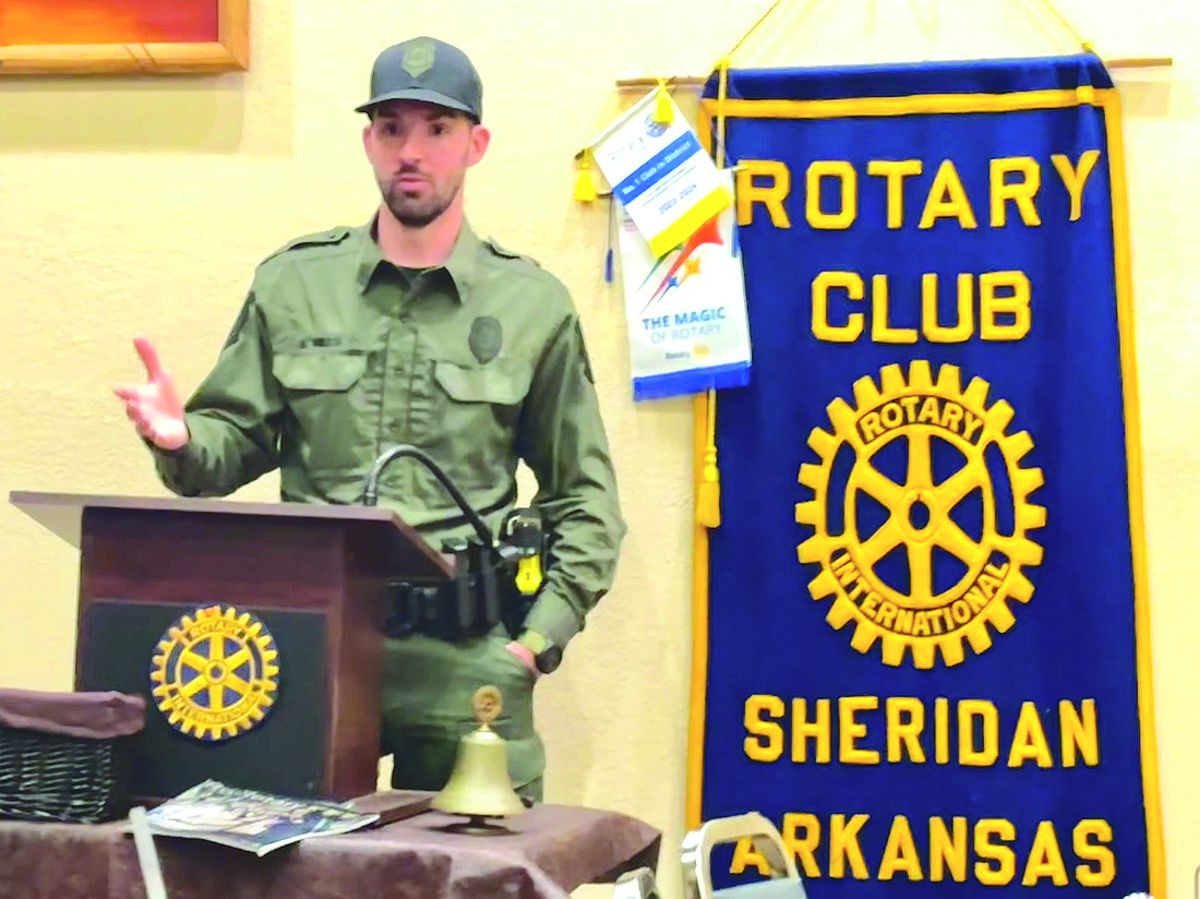 Landon Mills, with the Arkansas Game & Fish Commission, told Rotarians that the public should keep an eye out for bears. (Photo: Gretchen Ritchey)