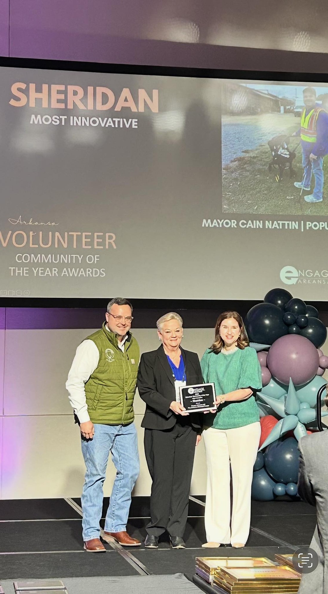 Sheridan Mayor Cain Nattin (left), Clean City Taskforce Jan Caldwell (center) receiving the Volunteer Community of the Year in the Most Innovative category from a representative with Arkansas at the Arkansas Municipal League Winter Conference last month. (Photo: Submitted)