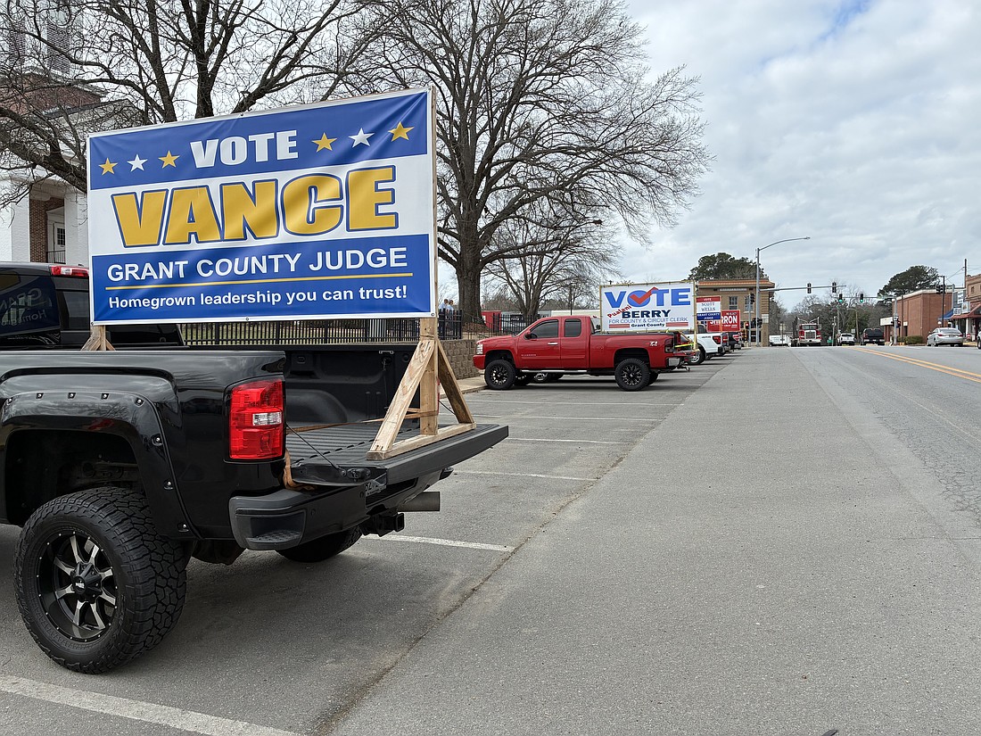 The front of the courthouse was a popular spot for political signs in advance of last Tuesday’s election. At this writing, county officials were still working with the state to determine why the state’s vote totals were different from those the county reported. (Photo: Byron Tate)