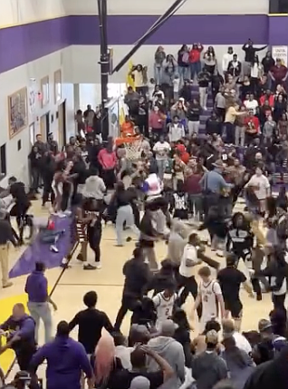 A screen shot of a fight that broke out after a basketball game during a tournament in Poyen shows the number of people involved.