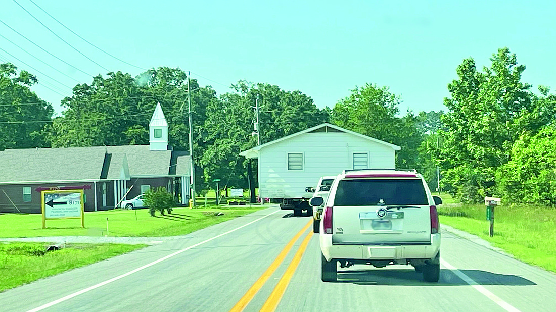 The residential home traveling south on Highway 190 in Tull in June 2022 that is at the center of the mobile home park zoning violations owned by Aaron Morehart. (Photo by Gretchen Rtichey)